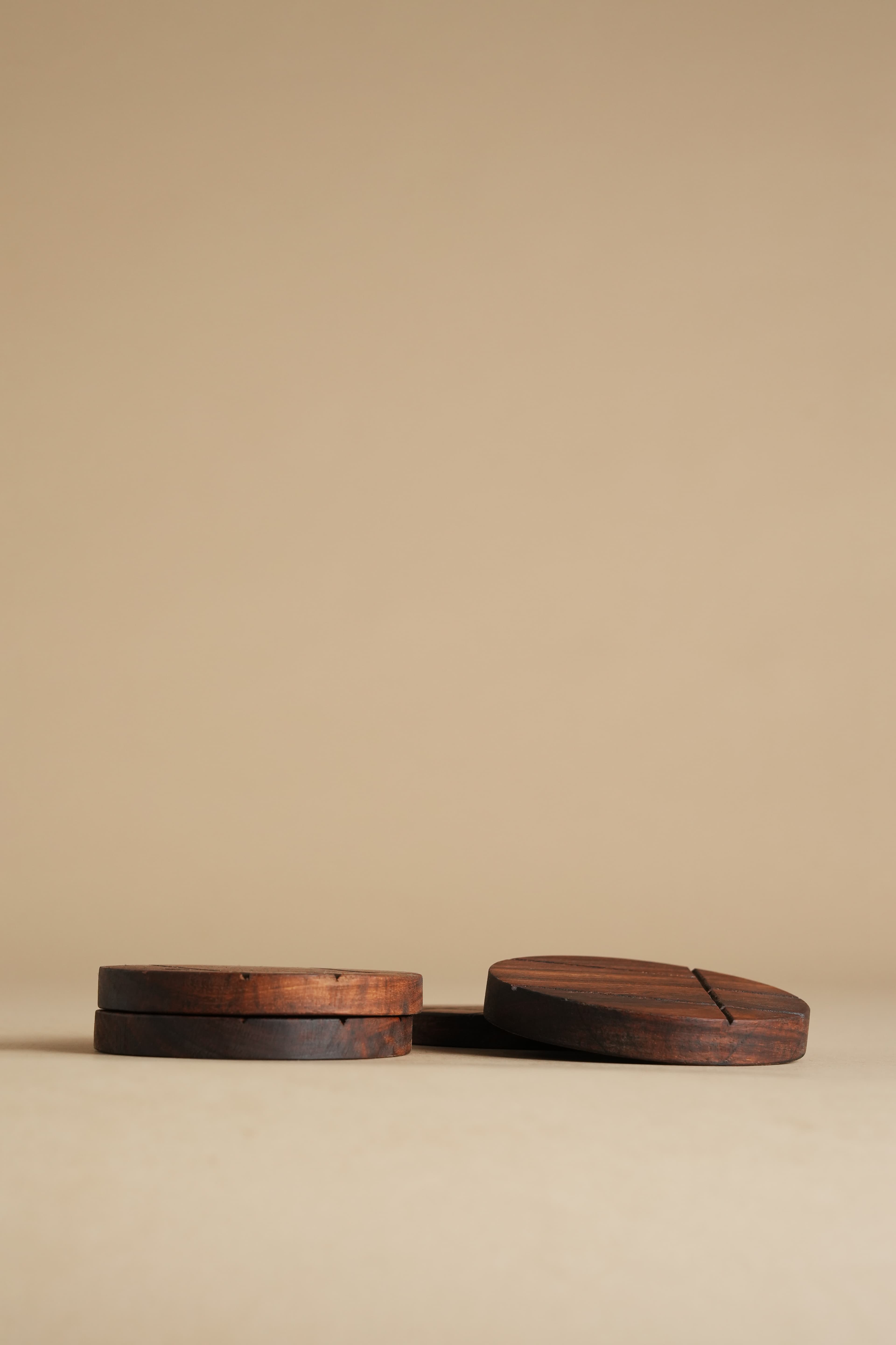 Hand-Carved Round Sheesham Table Coasters (Set of 4) - Lifestyle Scene