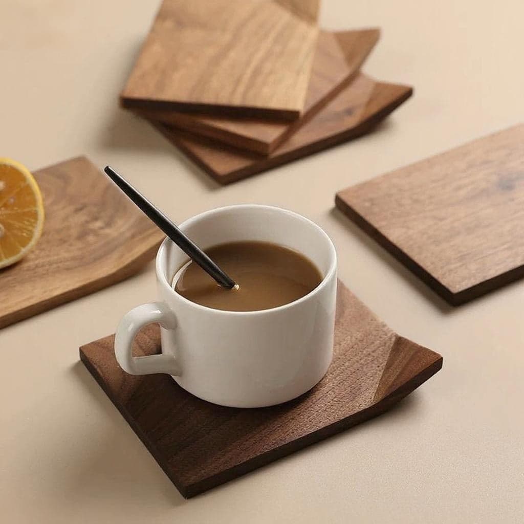 Little Roll Solid Walnut Coaster Set of 4 with Iced Coffee Tumbler on Marble Table