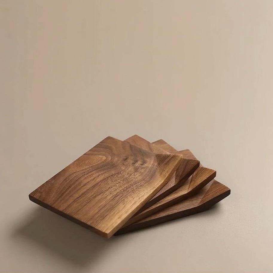 Stacked Composition of All 4 Coasters Showing Organic Wood Grain Variations