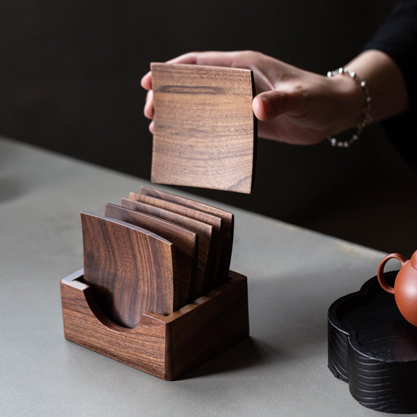 Studio Elevation Showing Coasters Stacking Neatly into Solid Walnut Holder