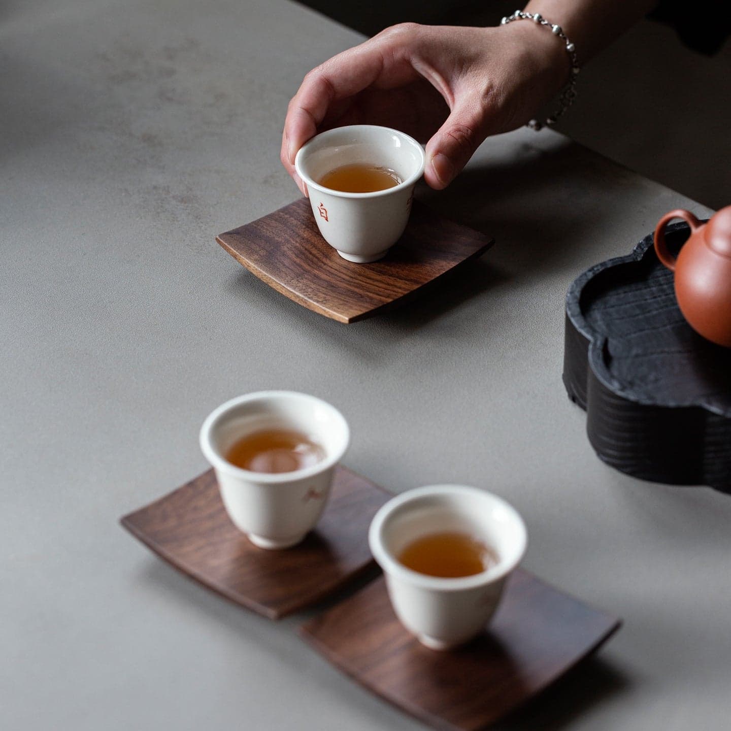 Coffee Table Setting with Glass Tumbler, Ceramic Mug, and Single Coaster